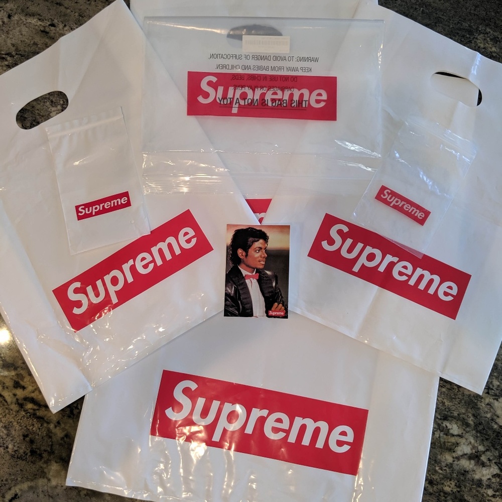 Seven (7) Supreme Shopping Bags